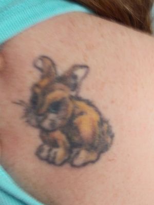 Refreshing this 30+ year old bunny tattoo. Before