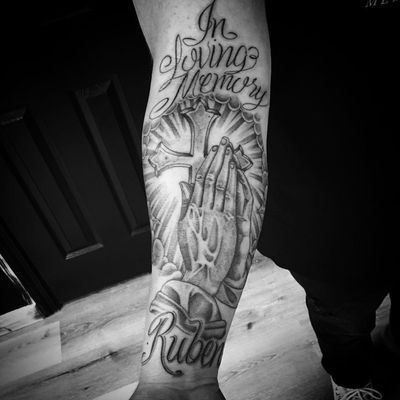 Clapper tattoo by Chuco Moreno #ChucoMoreno #arm #lettering #script #cross #oldschool #chicano #light #blackandgrey #clappertattoo #clappers #prayer #hands #religious #jesus #mary #iconic