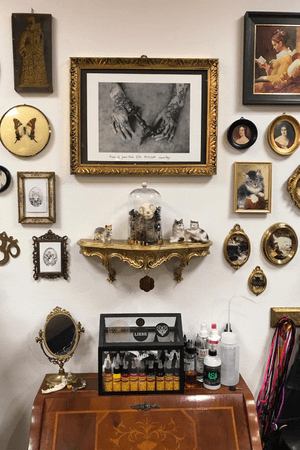 Hands of Janna Mach hanging in her work space