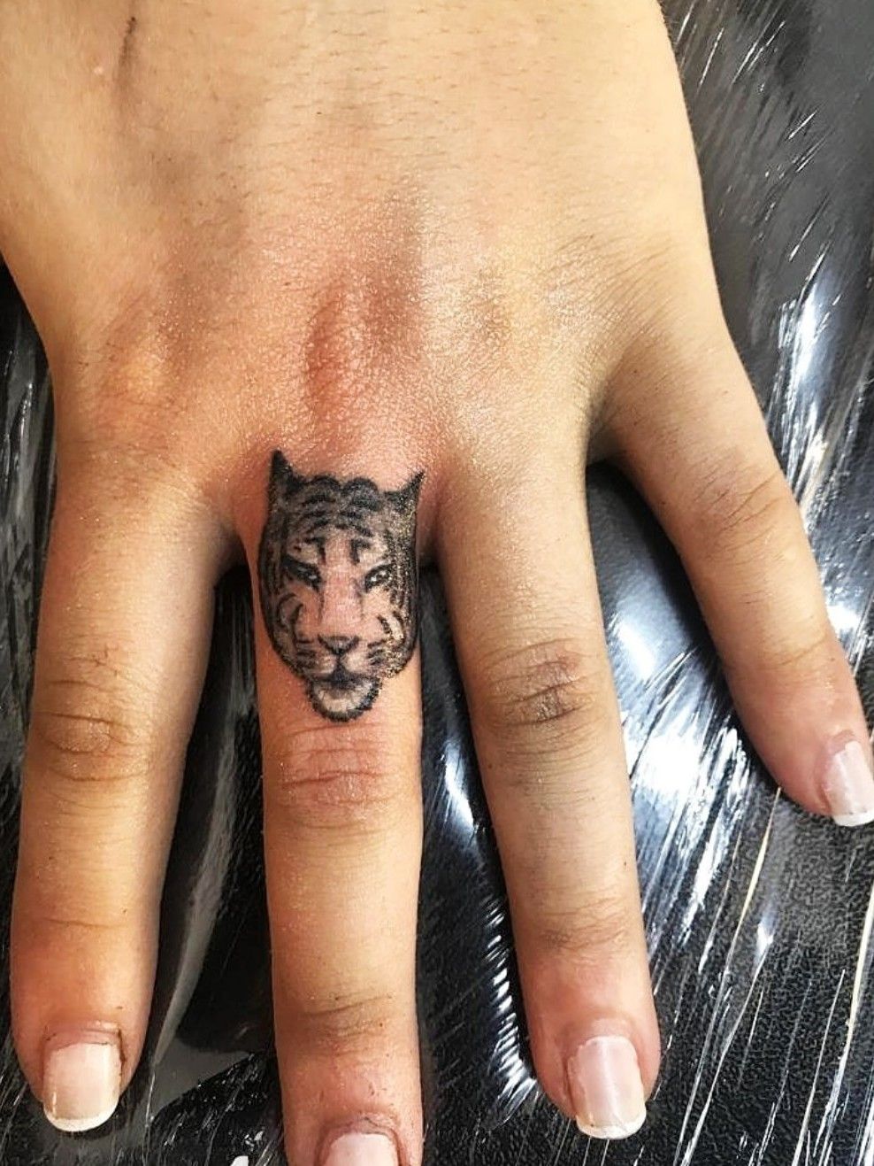 I would love to have a tigertattoo on my finger in honor of my brother who  passed away He had the nick  Finger tattoo designs Finger tattoos Tiger  tattoo small