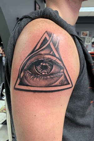Eye in triangle.