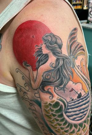 Tattoo by The Rising Phoenix Art Collective