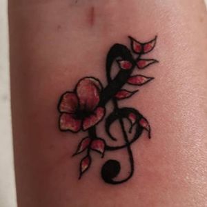 The lady that did this was amazing, family friend , meaning: Music note for my mum's who have a passion for music and the flowers for my siblings ❤️