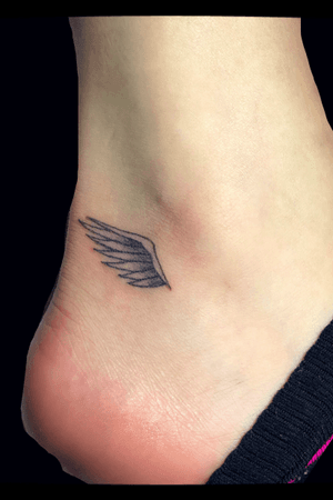 Small wings tattoo