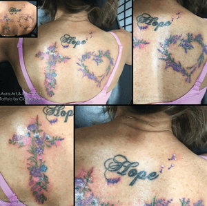 Tiny floral back tattoo.