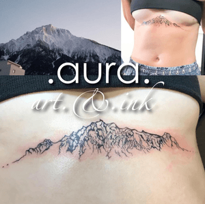 Swiss Alps mountain under-boob tattoo