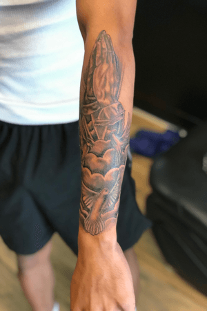 Prayer hands doves forearm tattoo 