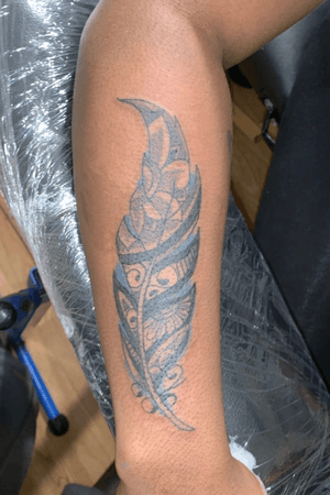 Tribal feather tattoo 