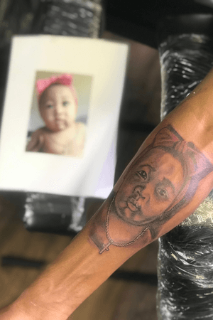 Baby portrait on forearm 