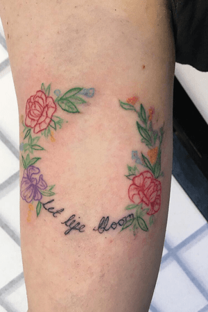 Changing up my tattoos for a change with this coloured outline piece. Floral wreath and hand written quote. 
