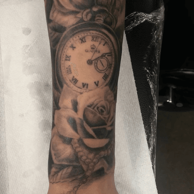 Some black and grey roses with a time piece i did a while back