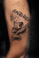 Stitch bkack and grey tattoing daughter’s name