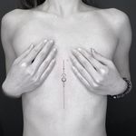 Minimal tattoo by Jack Poohvis #JackPoohvis #minimaltattoos #minimal #smalltattoos #small #simpletattoo #simpletattoos #linework #dotwork #sacredgeometry #geometry #sternum #chest #underboob