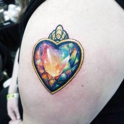 Rainbow gem from the Freddy tattoo expo! #gem #hearts #heartgem #rainbow #pendant #SailorMoon #sparkle #magic #crystal #gems #gemtattoo #crystals #crystaltattoo #jewelry #jewels #jewel 
