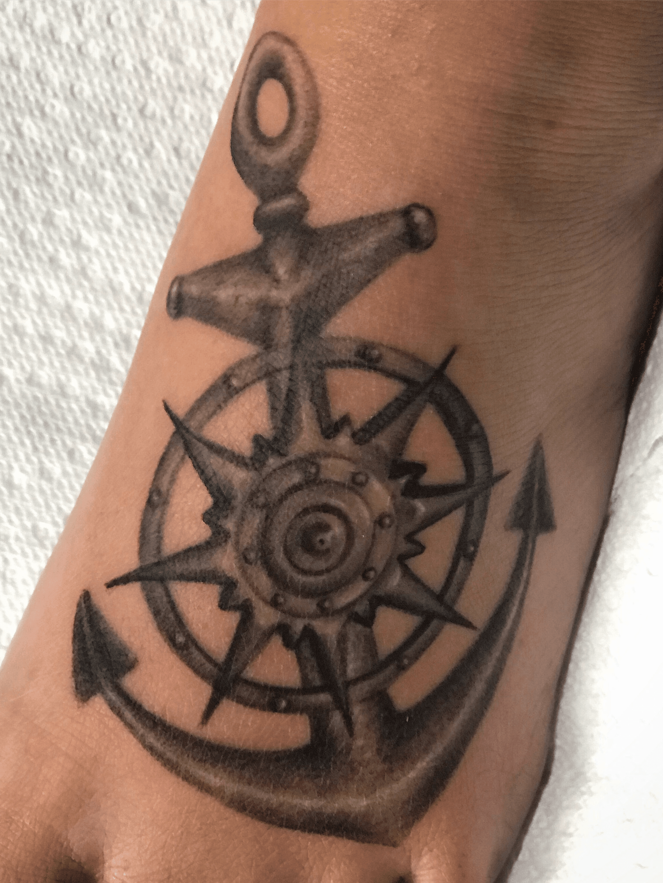 Three anchor tattoos on feet by Blaze Schwaller TattooNOW