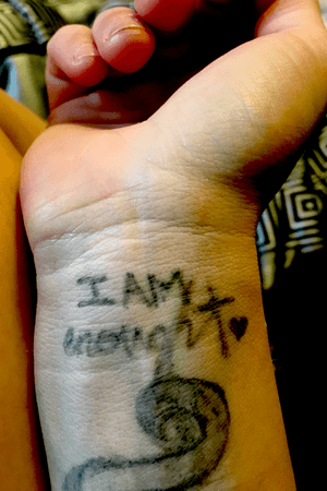 I am enuf . I tattood this with outdated ink that my friend had and again a first . This tattoo means more to me tho because i did it to cover my scars i have from me trying to commit suicide ... im better now and i jus tell myself i love me and im worth it and i am enuf!  :) 