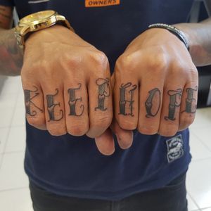 "Keep Hope" lettering tattoo on Finger