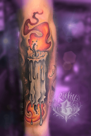 Double-sided candle squeezed in between two other tattoos