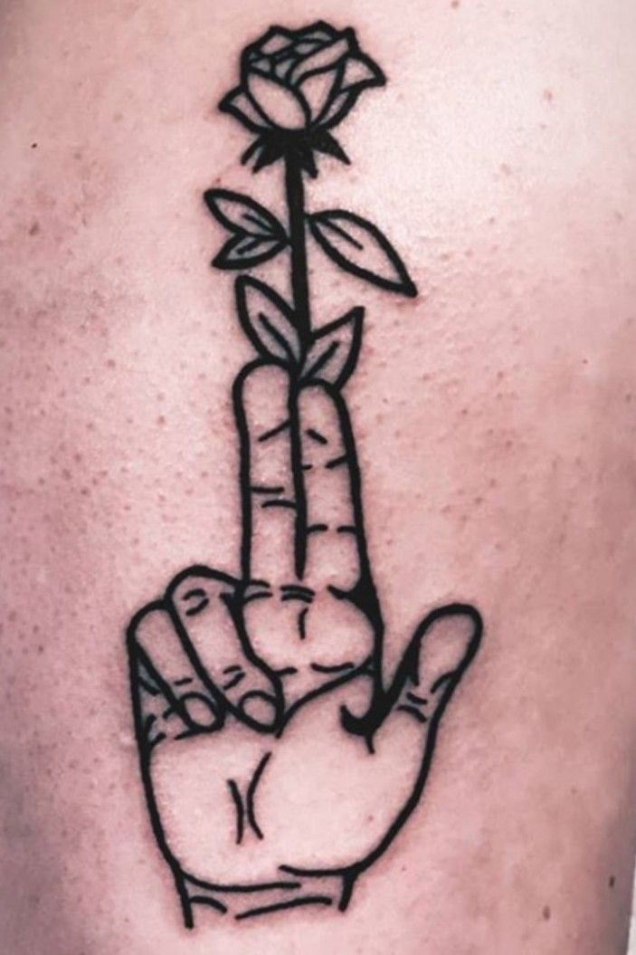 gun tattoo on finger