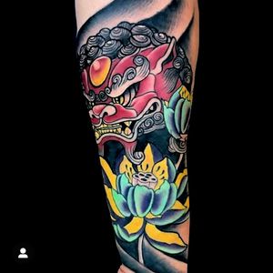 Japanese foo dog and lotus flowers.