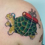 Cute tattoo by Wendy Pham #WendyPham #cutetattoos #cute #sweet #tattoosforgirls #tattoosforwomen #tattooideas #cooltattoos #love #color #shoulder #turtle #dynamite #funny