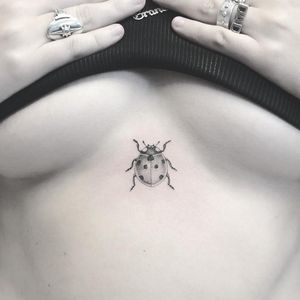 Cute tattoo by Annelie Fransson #AnnelieFransson #cutetattoos #cute #sweet #tattoosforgirls #tattoosforwomen #tattooideas #cooltattoos #love #blackandgrey #illustrative #sternum #ladybug