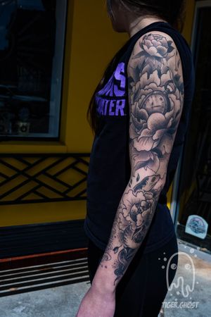 Full black ands grey sleeve featuring peonies, pocket watch, snakes and jellyfish. 