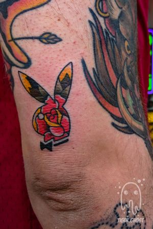 Playboy bunny with a traditional rose above the elbow.  // other work visible not by me //