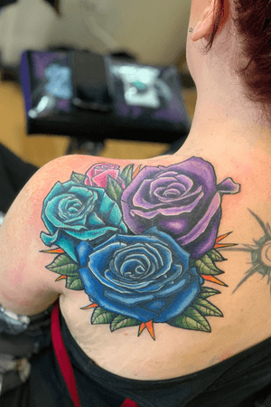 Roses cover up of solid black handprint. 