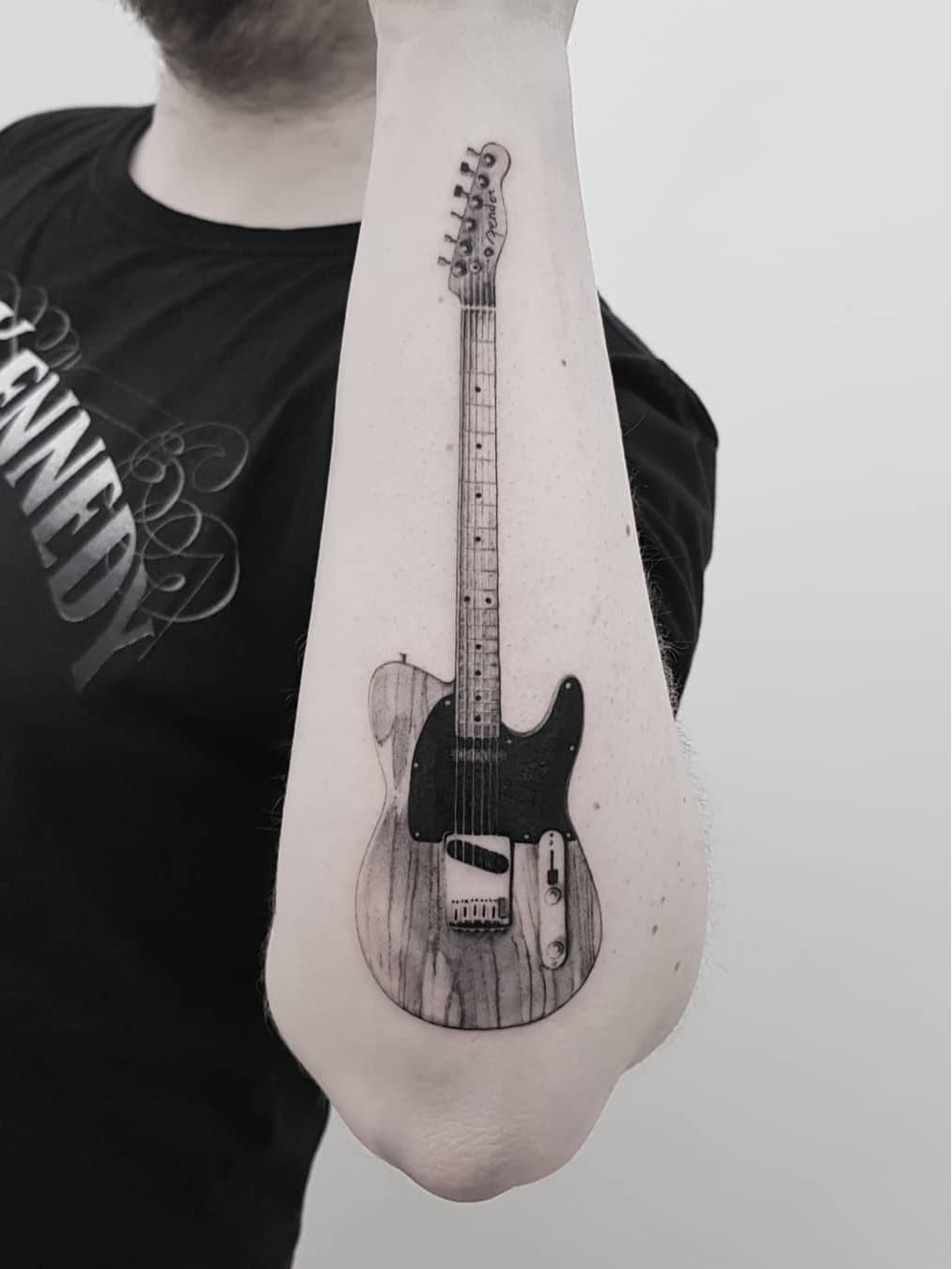 Tattoo of Guitars Forearm