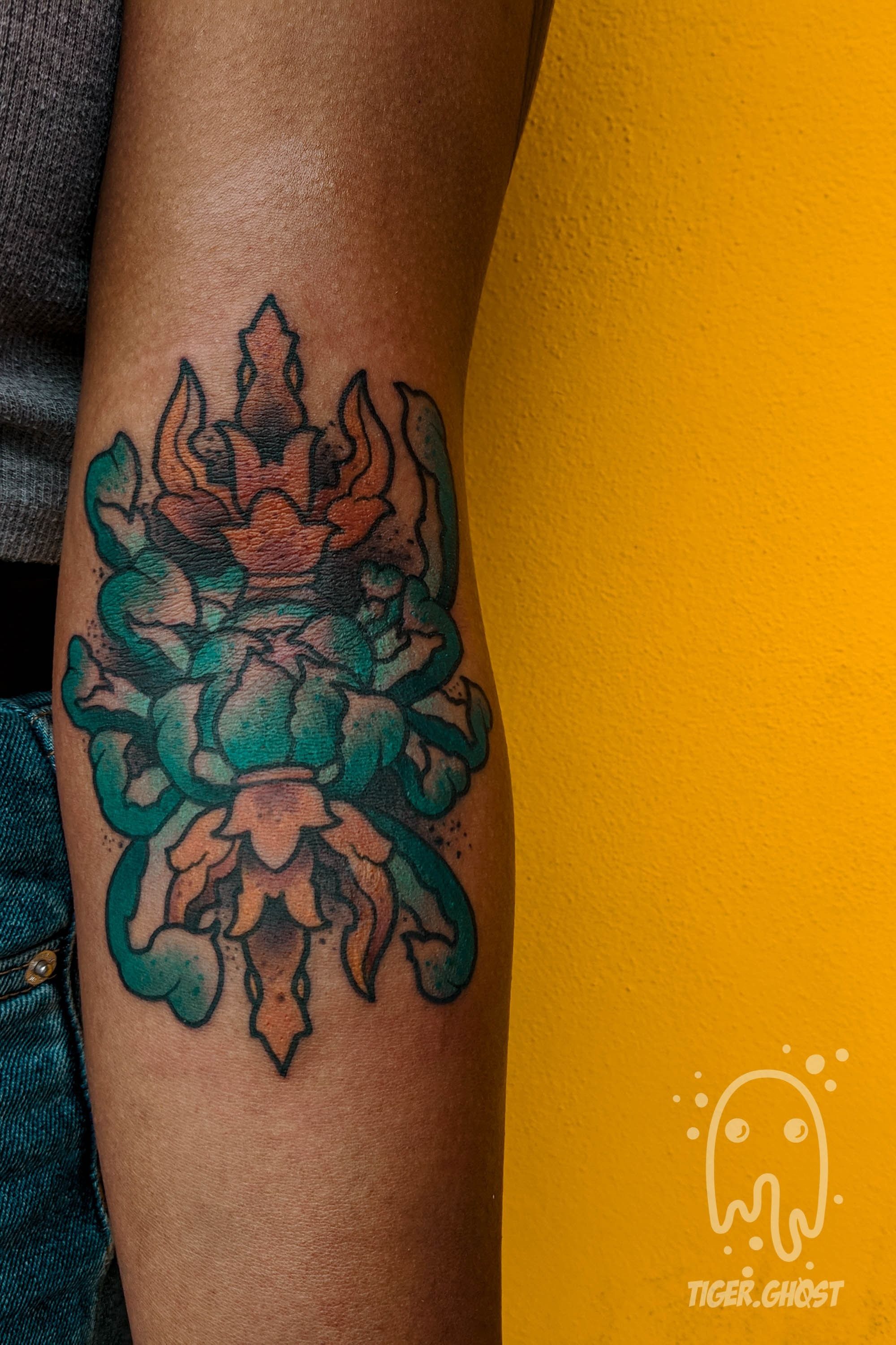 Tattoo uploaded by Tom - Robots x Raccoons • Thunderbolt (vajra) and  chrysanthemum on dark skin on the ditch of the elbow • Tattoodo