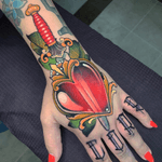 Glass heart palm hand tattoo