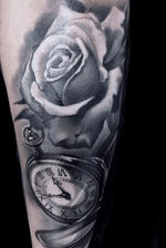 Realistic black and gray rose and clock 