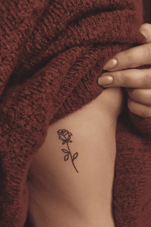 Inspirational fine lined rose tattoo