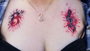 A couple ink splatter tattoos with semi colon and treble cleft with heart 