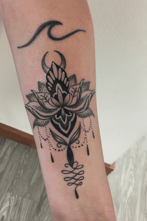 Stylized lotus on a forearm