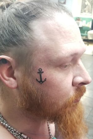Anchor face tattoo 