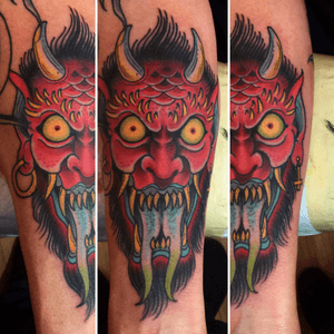 Wild devil head tattoo on forearm