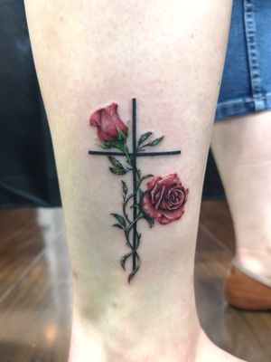 Small realistic rose in color with cross
