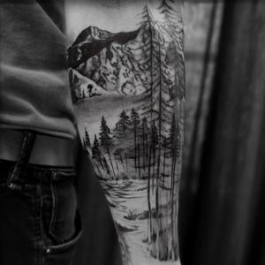 Forest tattoo by Jones Larsen #JonesLarsen #LacunaTattoo #realism #realistic ##mashup #tattoodoapp #tattooartist #tattooidea #cooltattoo #copenhagen #denmark #blackandgrey #forest #trees #mountains #arm