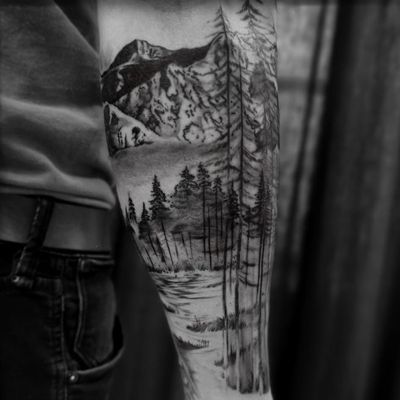 Forest tattoo by Jones Larsen #JonesLarsen #LacunaTattoo #realism #realistic ##mashup #tattoodoapp #tattooartist #tattooidea #cooltattoo #copenhagen #denmark #blackandgrey #forest #trees #mountains #arm