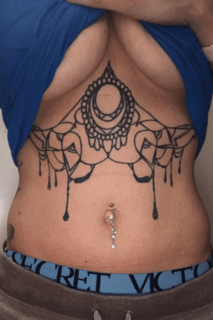 #sternum #underboob #linework -middle piece by thebeardedeagle on ig (cincinstti, oh) extended line work done by @tatsbypope on ig (Athens, al)