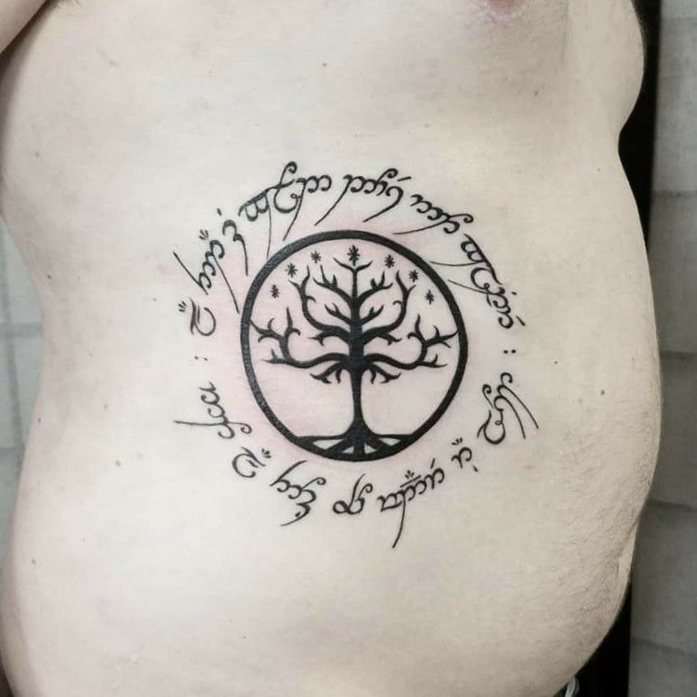 Tattoo uploaded by Lilith Andraste • The tree of Gondor and Elvish script.  #lotrtattoo #blackworktattoo #lineworktattoo #elvish #nerdtattoo  #cooltattoos • Tattoodo