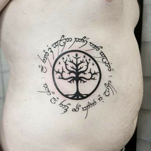 The tree of Gondor and Elvish script.#lotrtattoo #blackworktattoo #lineworktattoo #elvish #nerdtattoo #cooltattoos 