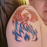 Phoenix rising from blue flames