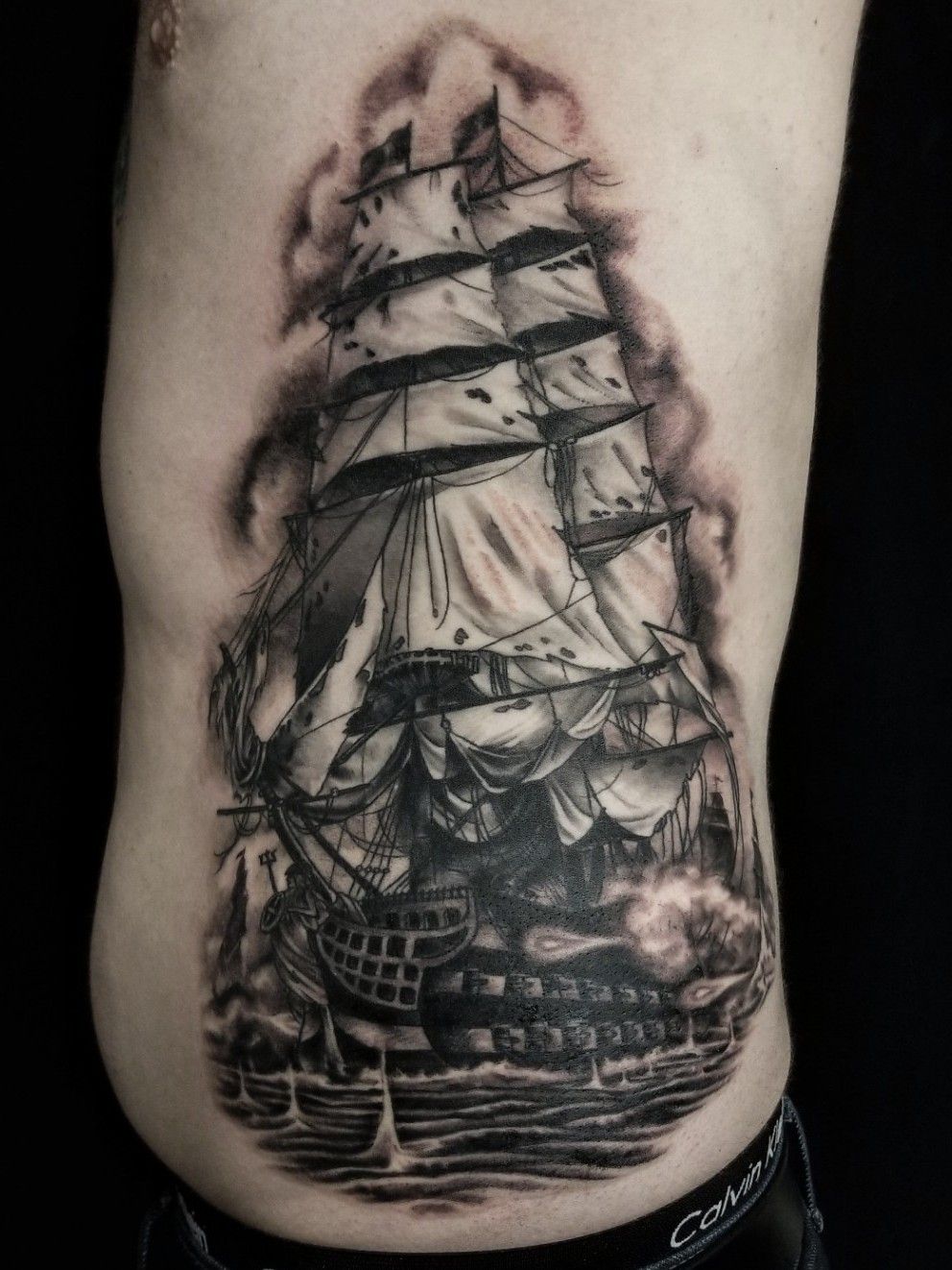 tattered pirate flag tattoo