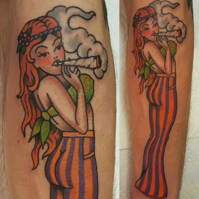 Traditional American pinup girl redhead hippie striped pants smoking joint weed Marijuana 
