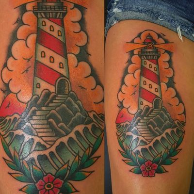 Traditional American lighthouse rocks water ocean flower