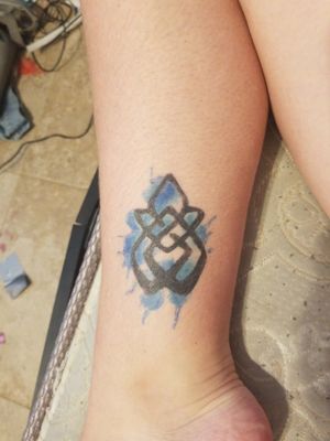 Currently my first and only tattoo... the symbol represents that I'm a sexual abuse survivor and the color behind it represents my randome creativity. Blue is also my favorite color 