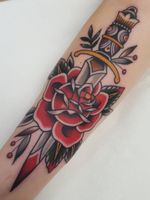 Traditional rose tattoo by Nikko Tattooer of Berlin Ink #NikkoTattooer #BerlinInk #traditionalrosetattoo #traditionalrose #rosetattoo #traditionaltattoo #traditional #flower #floral #plant #color #dagger #sword